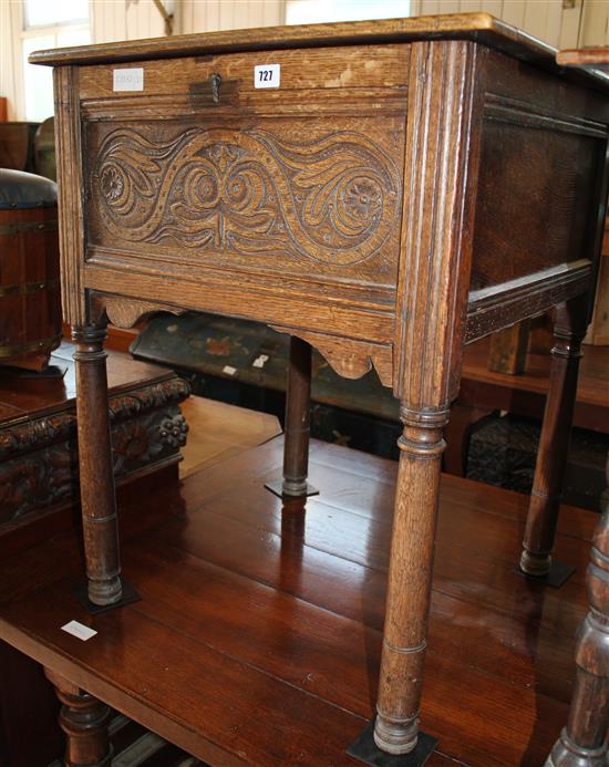 Carved oak box on supports